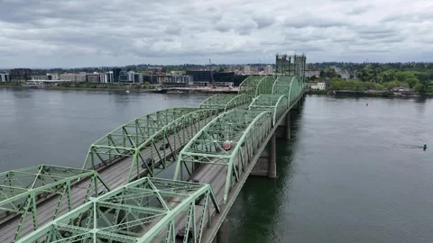 Interstate Bridge with green steel truss spans crossing Columbia River toward Stock Footage 336036023