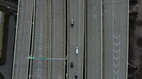 Interstate Exits Horizontal Lines Slow Overhead PullBack RAW 2K Stock Footage 260516373