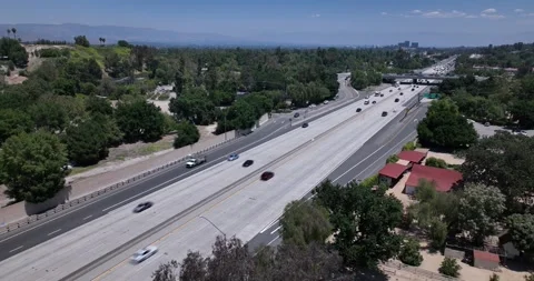Interstate Freeway and Suburbs Calabasas California Drone Aerial View Stock Footage 250574443