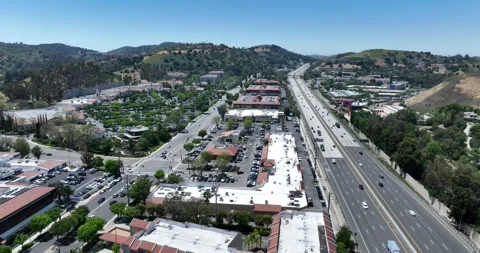 Interstate Freeway and Suburbs Calabasas California Drone Aerial View Stock Footage 250574632