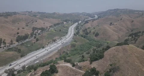 Interstate Freeway and Suburbs Calabasas California Drone Aerial View Stock Footage 250575744