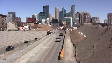 Interstate Freeway Road Construction with City Skyline behind Stock Footage 105139035