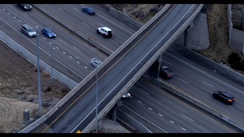 Interstate Highway Interchange Aerial Shot with City in the Background Stock Footage 100135599