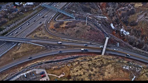 Interstate Highway Interchange Aerial Shot with City in the Background Stock Footage 100135802