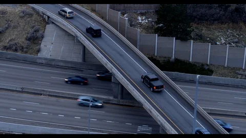 Interstate Highway Interchange Aerial Shot with City in the Background Stock Footage 100136616