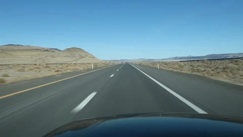 INTERSTATE TRAVEL ON I-80 THROUGH NEVADA DESERT DRIVERS POV Stock Footage 96228294