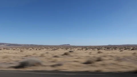 INTERSTATE TRAVEL ON I-80 THROUGH NEVADA DESERT WINDOW VIEW Stock Footage 96228308