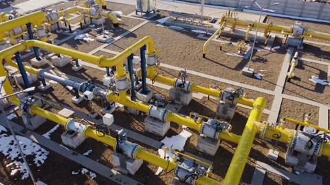 Intertwined yellow pipes construction marvel redefine industrial landscapes. Stock Footage 265482265