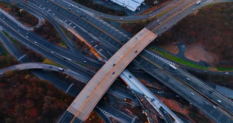 Intertwining motorways with a bridge above. Multiple roads close to each other Stock Footage 332306820