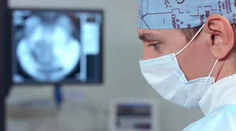 Interventional radiologist performs operation Stock Footage 57358566