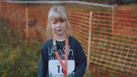 Interview with a child athlete with a medal Stock Footage 214080469