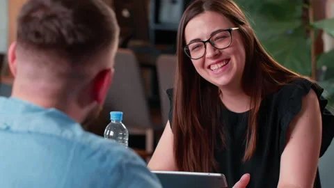 Interview concept. Beautiful young happy Caucasian smiling female HR manager Stock Footage 136199670
