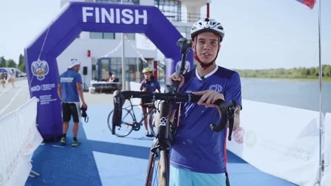 Interview of a cyclist, a cyclist speaks on camera Stock Footage 203970782