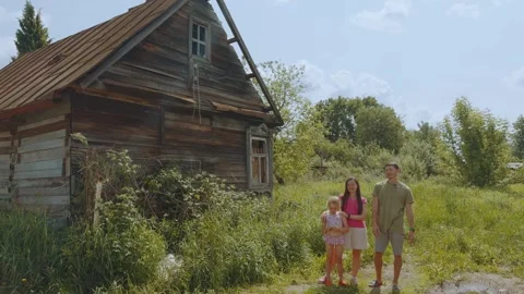 Interview of a family on the background of an old plot Stockbeeldmateriaal 320360052