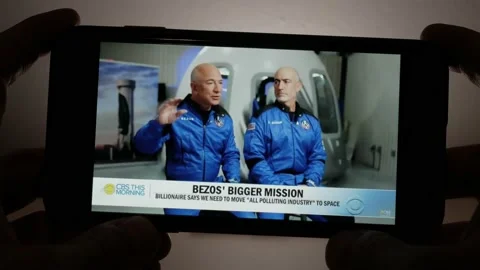 Interview with Jeff Bezos seen from the smartphone Stock Footage 157653541