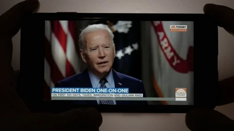 Interview with Joe Biden seen from smartphone Stock Footage 157653536