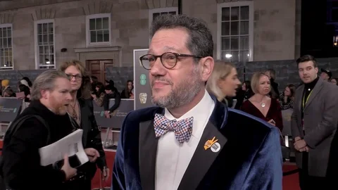 Interview with Michael Giacchino at red carpet during BAFTAs - London 2020 Stock Footage 125802528