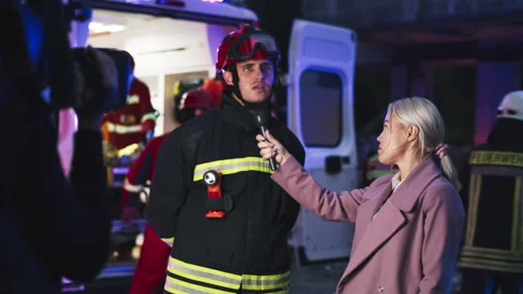 Interview near emergency van in evening Stock Footage 166145783