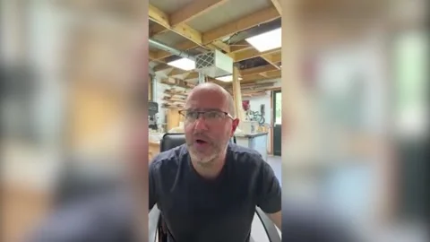 Interview with Oliver Pett who builds complicated mechanical contraptions or 'a Video stock 312015610