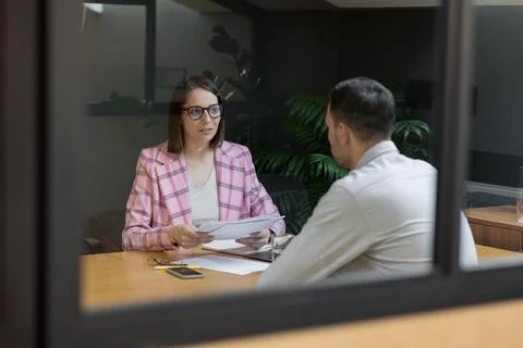 Interview or negotiation, successful and beautiful business woman in her office Stock Photos