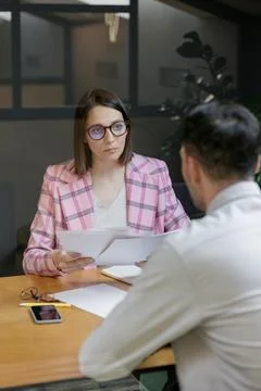 Interview or negotiation, successful and beautiful business woman in her office Stock Photos