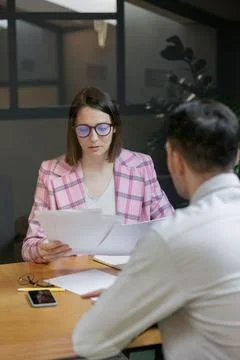 Interview or negotiation, successful and beautiful business woman in her office Stock Photos