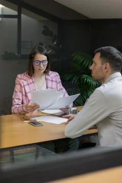 Interview or negotiation, successful and beautiful business woman in her office Stock Photos