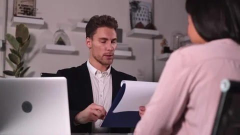 Interview for people will be conducted by man in business suit in office for Stock Footage 150589035