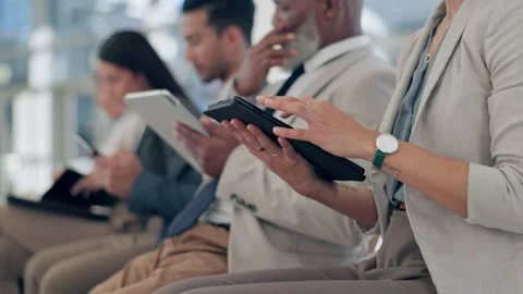 Interview queue, waiting room and hands on tablet, typing or scroll for business Stock Footage 254946545