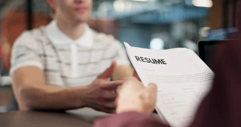 Interview, recruitment and hands in office with resume, portfolio or meeting in Stock Footage 340607674