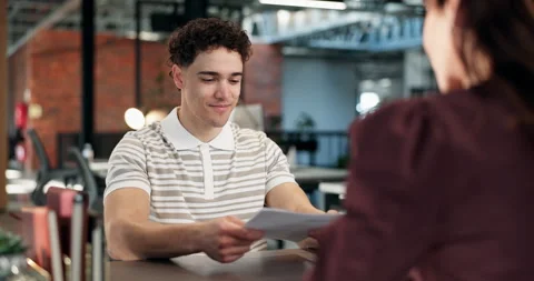Interview, recruitment and man in office with portfolio, resume or meeting in Stock Footage 340607645