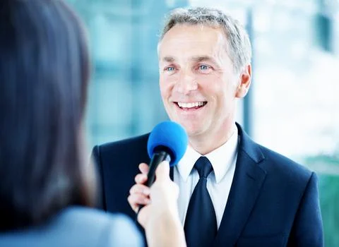 Interview, smile and question with man and microphone for senator, political cam Fotos Stock