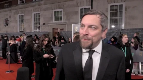 Interview with Todd Douglas Miller at red carpet during BAFTAs - London 2020 Stock Footage 125802961
