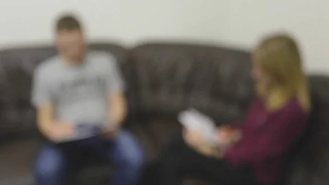 Interview, two business people talks, intentionally defocused image Stock Footage 74082973