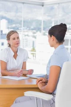 Interviewer and interviewee talking together Stock Photos