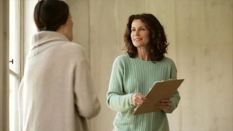 Interviewer greeting a potential employee. 스톡 동영상 88406155