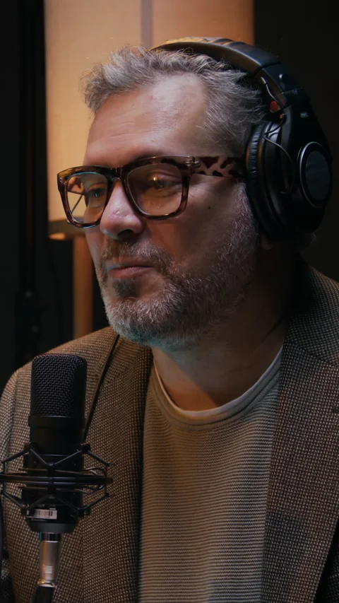 Interviewer in Headphones Asking Question on Podcast 스톡 동영상 293254190