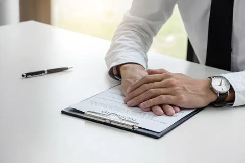 Interviewer or Board reading a resume during a job interview, Employer interv Stock Photos