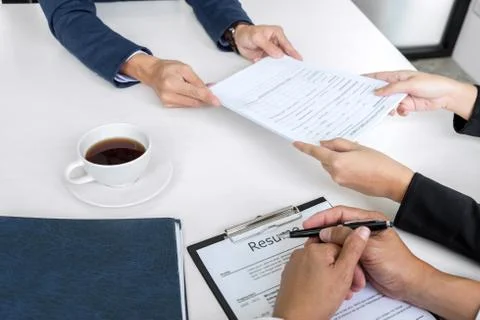 Interviewer or Board reading a resume during a job interview, Employer interv Stock Photos
