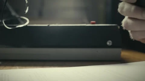 Interviewer sound checks desk microphone for cassette tape recording Stock Footage 308789185