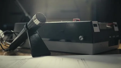 Interviewer sound checks Desktop microphone for cassette tape recording Stock Footage 308788447