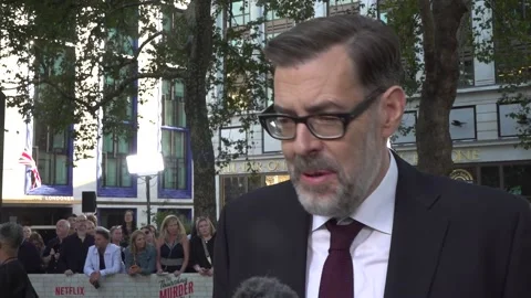 Interviews with Richard Osman, Richard E Grant, and Geoff Bell at the premiere  Stock Footage 315244149