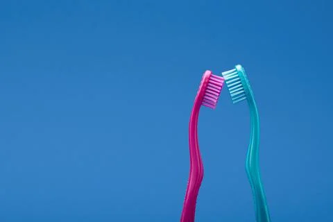 Intimacy concept using two toothbrushes with heads touching 스톡 사진