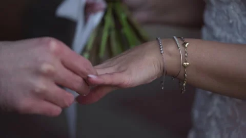 An Intimate and Heartwarming Wedding Ring Exchange Ceremony Moment Full of Video stock 314576772