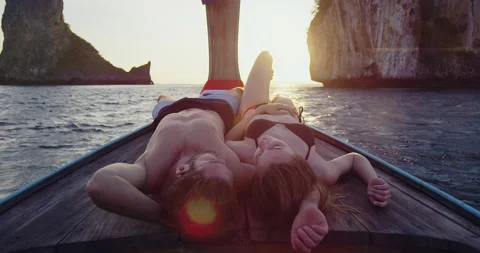 Intimate and in love couple on authentic, sunset romantic long tail boat tour in Video stock 201094328