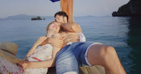 Intimate and in love couple on authentic, sunset romantic long tail boat tour in Stock Footage 201094574