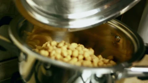 Intimate chickpeas boiling for a savory poultry stuffing in detail, 4K Stock Footage 341105997