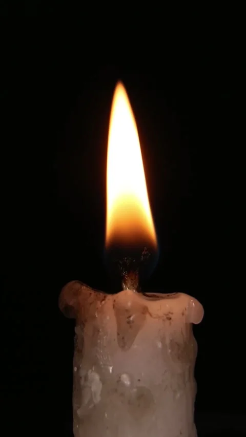 Intimate Flickering Candle Flame Against Black Background Stock Footage 311044552