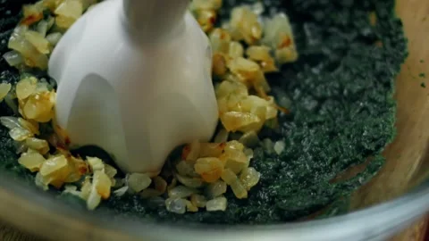 Intimate flour sprinkled over spinach and cheese mixture in warm light, 4K Stock Footage 341110347