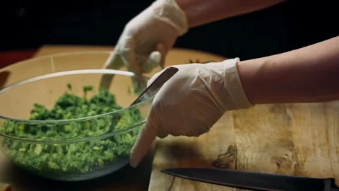 Intimate hands shaping spinach mixture into a thick round patty in hero view, 4K Stock Footage 341110478